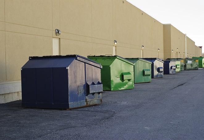 construction crew disposing of building materials in large bins in Clarksville, NY